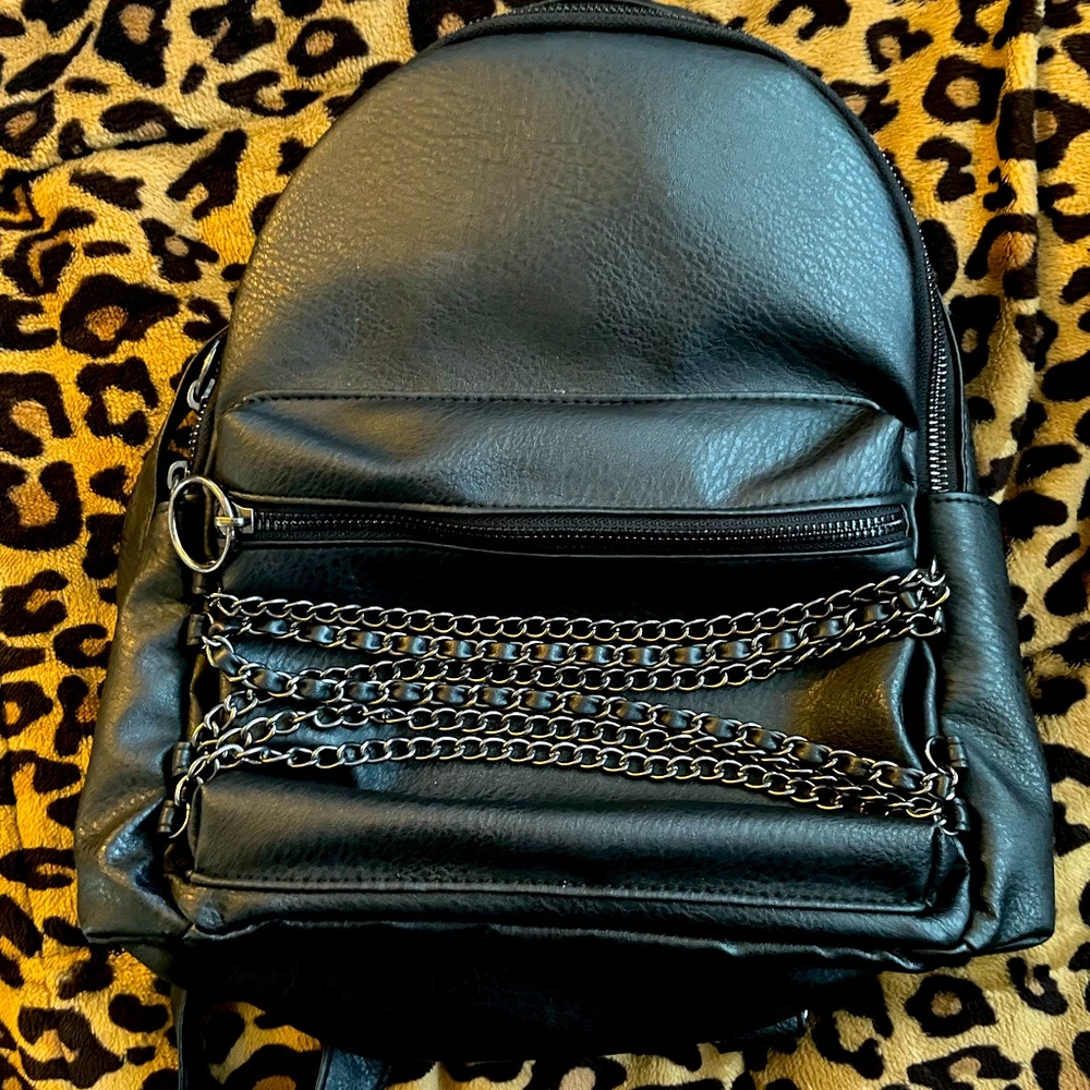 Black mid size backpack purse.